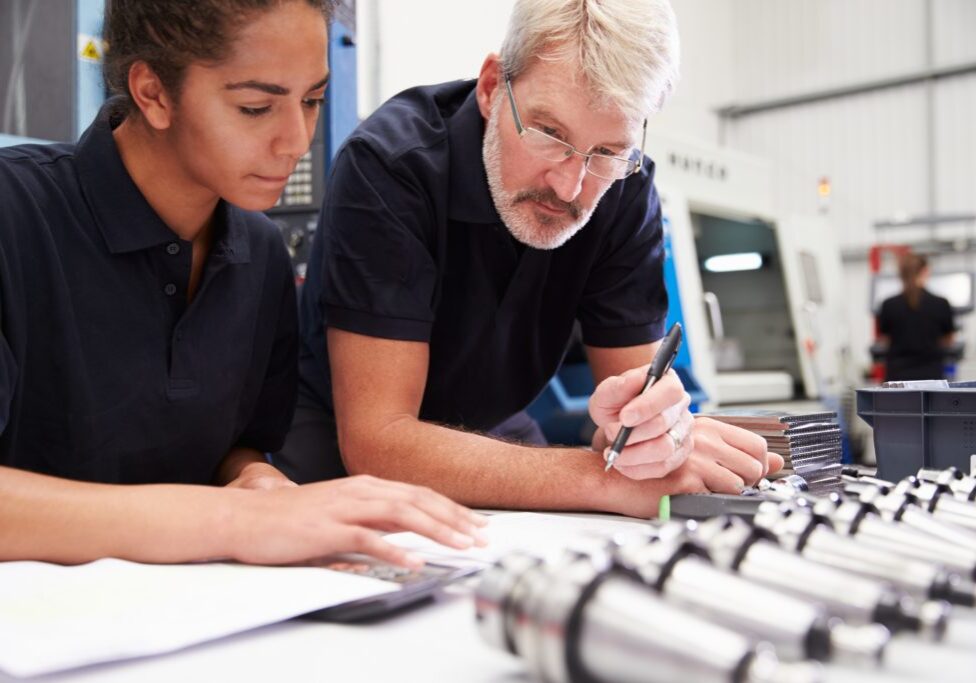 Engineer And Apprentice Planning CNC Machinery Project Work with Walker Tape Converting